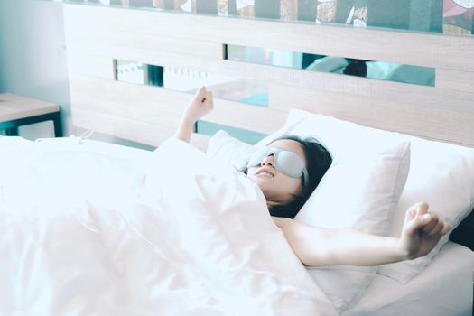 women sleep in white pillow on bed, after waking up in the sweet morning