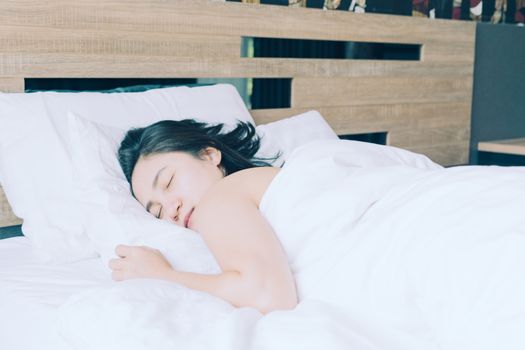 happy women sleep in white pillow on bed