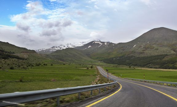 The highway leads from the city of Kayseri to the foot of Mount Erciyes, spring in central Turkey