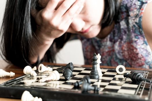 the loser women sad after  fighting the chess, committed, competition, winner, successful, dedicate concept