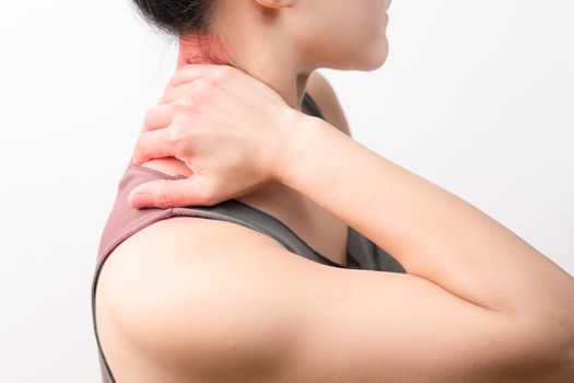 closeup women neck and shoulder pain/injury with red highlights on pain area with white backgrounds, healthcare and medical concept