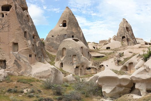 Residential caves in the Cappadocia mountains against the blue sky