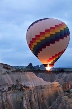 A view of the colored balloons flying over the Valley of Love at dawn. Cappadocia, Turkey.