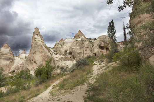 Abandoned caves in the Cappadocia mountains against the blue sky