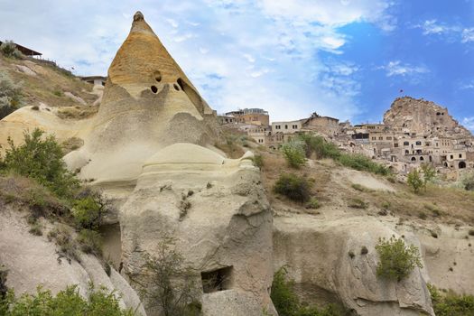 Residential caves in the Cappadocia mountains against the blue sky