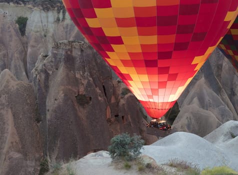 A view of the colored balloon flying over the Valley at dawn. Cappadocia. 12.05.2018. Turkey.