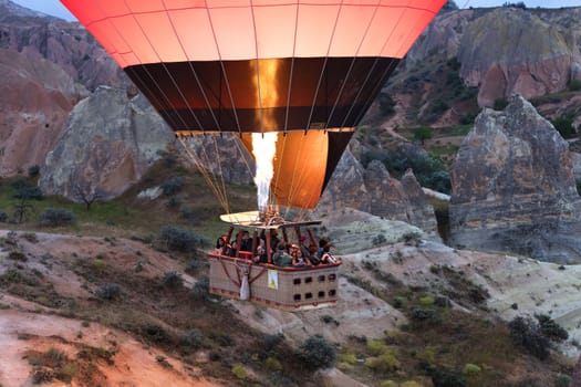 A view of the colored balloon flying over the Valley at dawn. Cappadocia. 12.05.2018. Turkey.