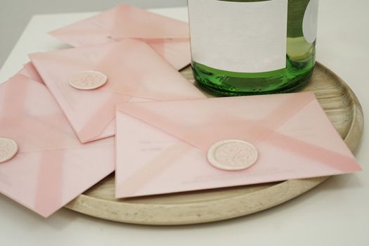 Gift certificates in a pink envelope. Wedding invitation or Valentine's Day cards