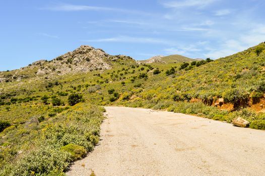 Crete island mountains and winding road. Asphalt road in a natural landscape.