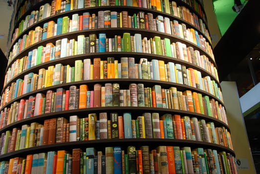 Books in a tower-shaped bookcase