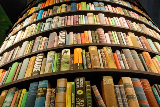 Books in a tower-shaped bookcase