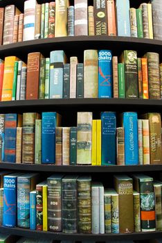 Detail of books in a tower-shaped bookcase - Turin, Italy - May 2011