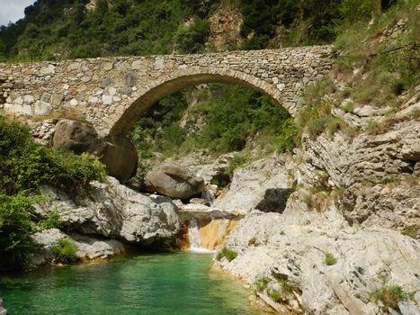 Stone bridge in the Nervia Valley near the Rio Barbaira stream, Rocchetta Nervina, Liguria - Italy