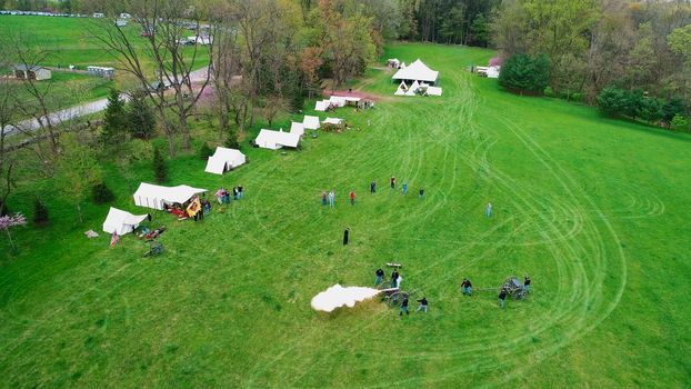 Aerial View of a Civil War Reenactment Cannon Firing on a Sunny Summer Day as Seen by a Drone