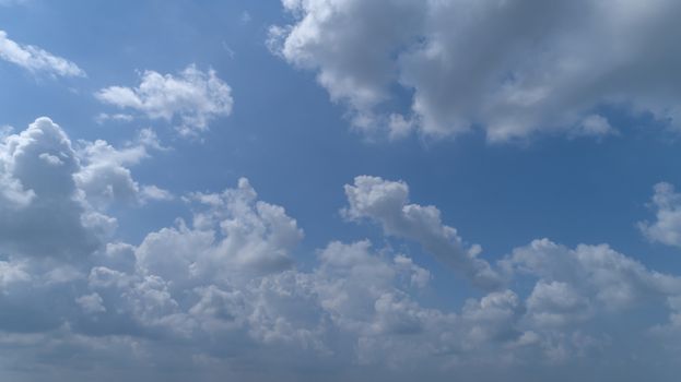 White and Dark Fluffy Clouds Floating in the Bright Blue Skies on a Summer Day