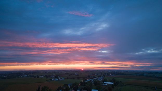 An Aerial View of a Sunset with Red and Blues on a Summer Night