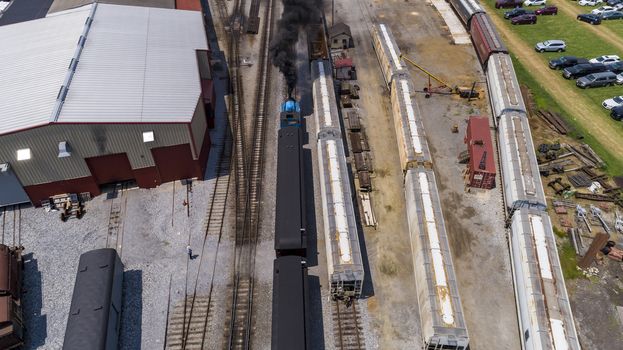 Aerial View of Train Yard Waiting for Trains on a Sunny Summer Day