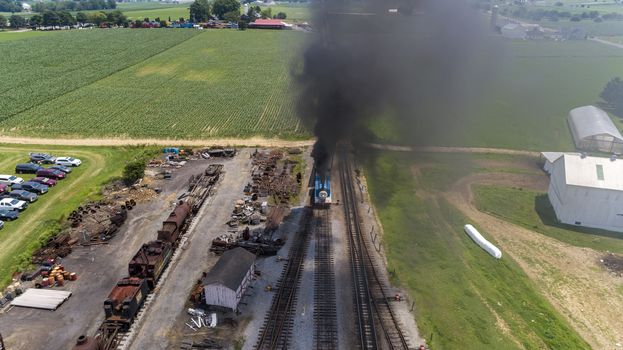 Aerial View of Train Yard Waiting for Thomas the Train Puffing Smoke on a Sunny Summer Day