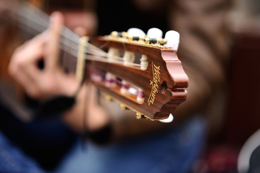 14-11-2018.Baku.Azerbaijan.Musician playing the guitar on the street in the photo close-up