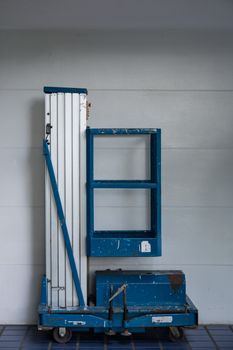 distribution warehouse hall with hydraulic scissors lift platform