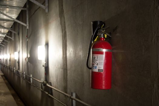 Fire extinguisher in dimly lit corridor Fire safety underground