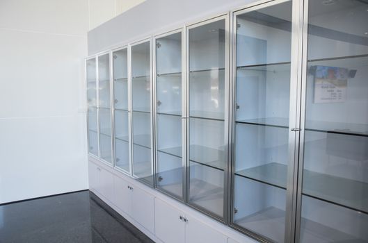Glass showcase. Glossy feed products. Presentation.