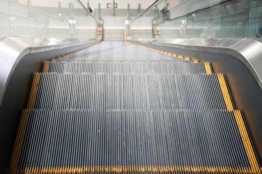 Escalator stairs in station.