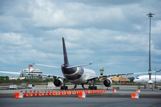 Passenger planes at the airport shoot on the bus