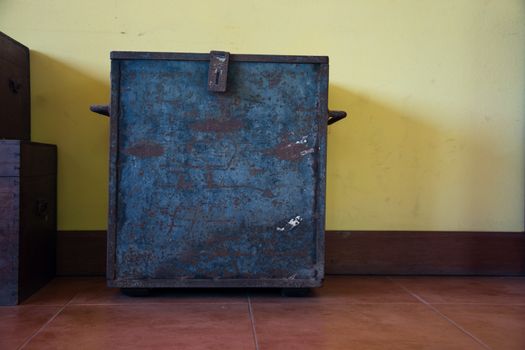 chest on an antique yellow wall  backgrounds