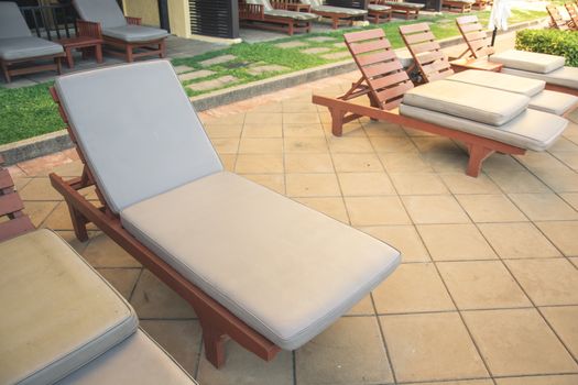 Chairs on a pool deck in hotel