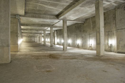 Empty industrial garage room interior with concrete floor and wall background