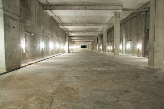 Empty industrial garage room interior with concrete floor and wall background