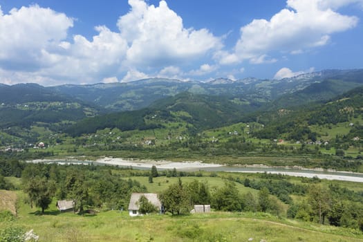 In the colorful valley of Montenegro, a mountain river flows, bringing to the village clean water and coolness