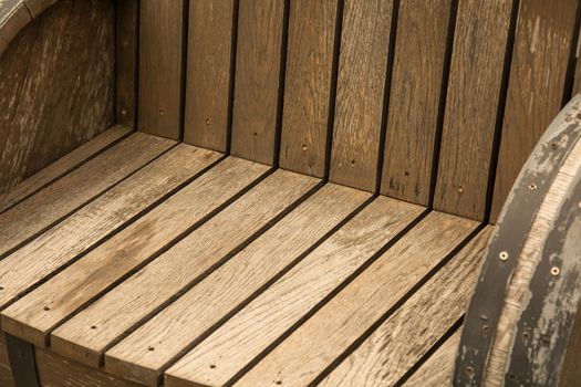A wooden garden chair seat in a detail