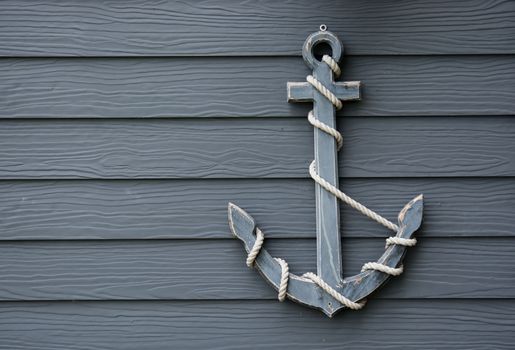 wooden anchor on wall vintage background
