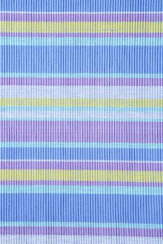 Colorful striped ribbed woven cotton place mat - background, full frame