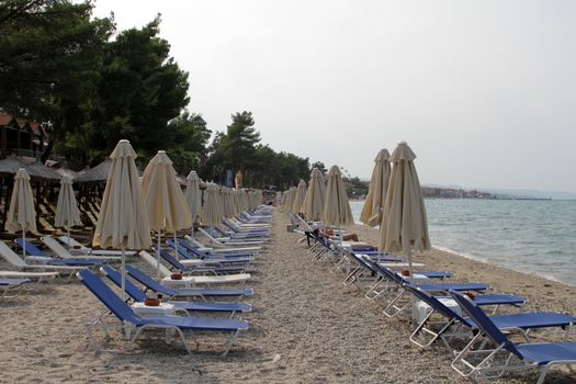 beach with sun beds and parasols