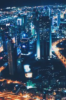 Aerial night view of Dubai in United Arab Emirates, metropolitan cityscape scenery