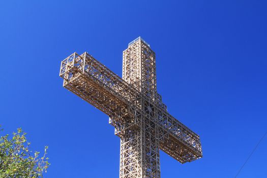 big cross in blue clear sky