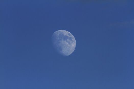zoom moon in blue sky