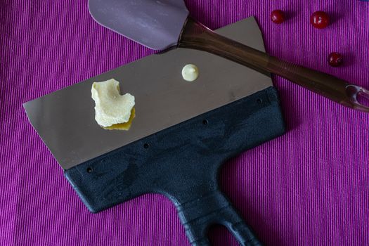 Close-up of a professional artisan pastry shop. A piece of white chocolate is prepared for home cooking useful and delicious sweets