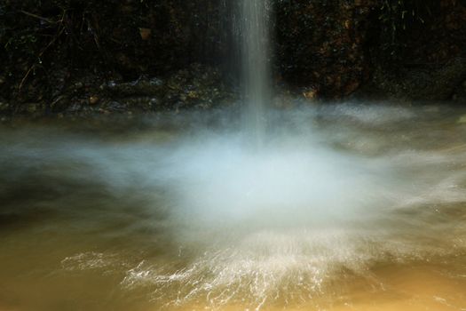 small waterfall in natural long exposition