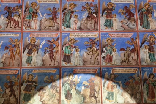 Rila Mountains, Bulgaria - 8 October 2017: Frescoes showing sins, Rila Monastery