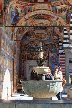 Rila Mountains, Bulgaria - 8 October 2017: Outer corridor with frescoes and fountains