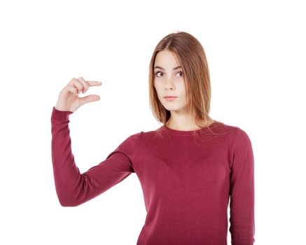 young beautiful girl in a red sweater showing a little gesture