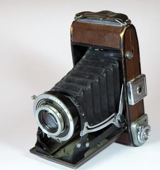 vintage camera with big lens on light background