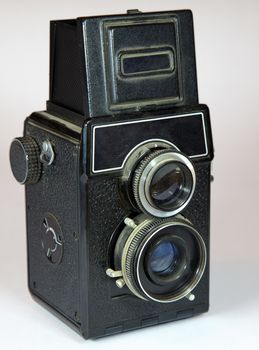 old vitage camera with two lenses on light background