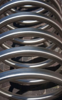 large metal spiral as an abstract background closeup outside