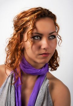 The portrait of brunette woman in the studio