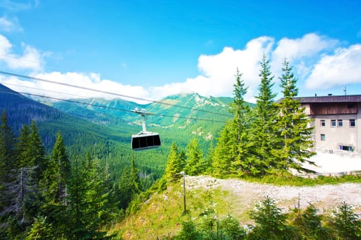 Gondola cable car in mountains. Vacation in mountains.